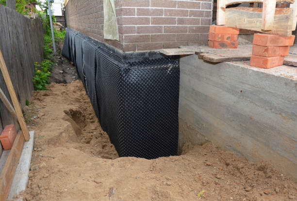 Happy homeowners after waterproofing job in East Brunswick